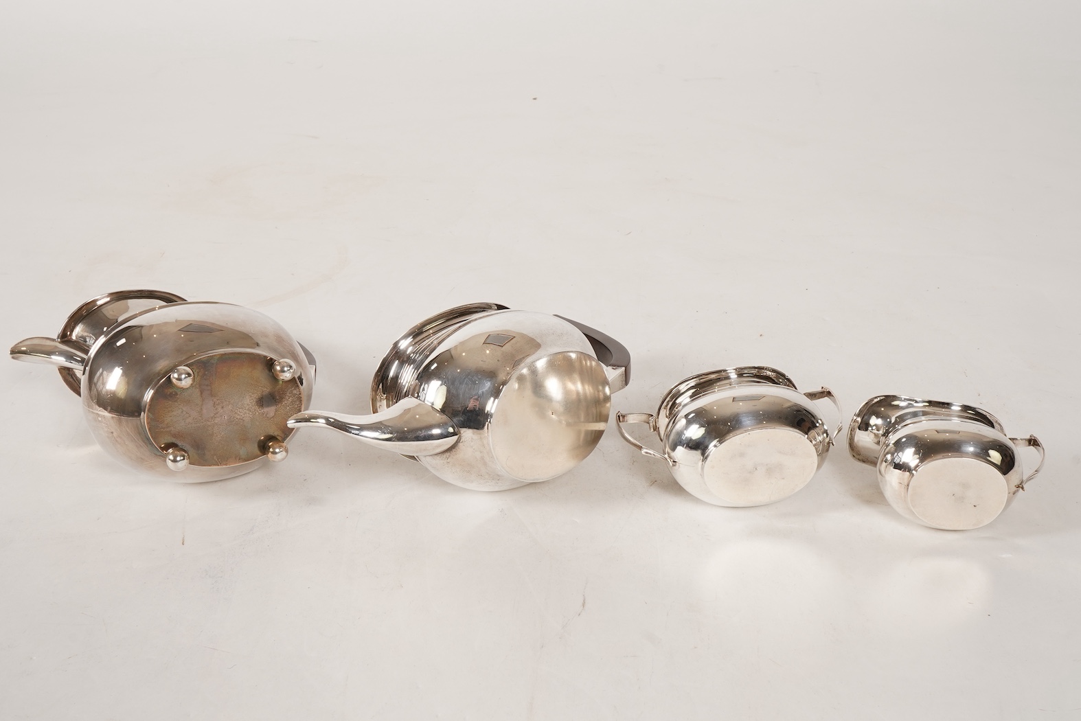 A George V four piece silver tea set, comprising teapot, hot water pot, sugar bowl and milk jug, by S. Blanckensee & Son Ltd